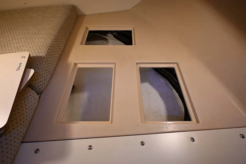 Slide: The Image of Interior view of 2002 Island Packet 350 sailboat with storage compartments. - 82