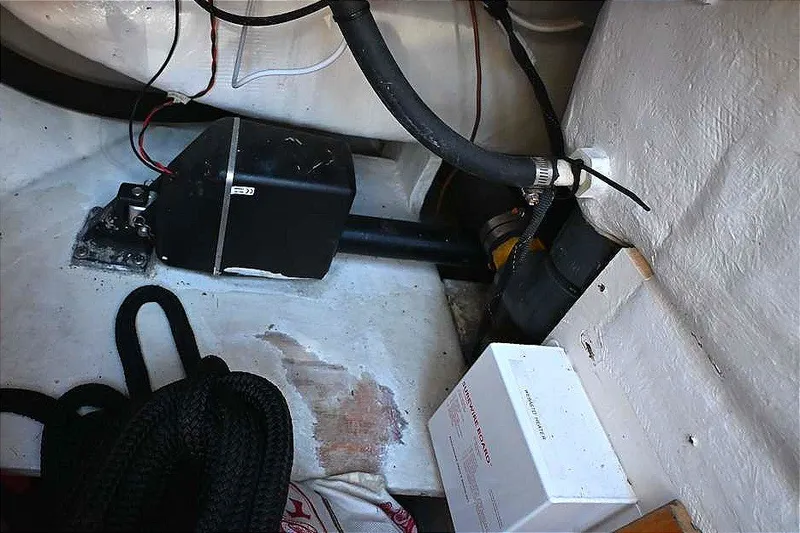 Slide: The Image of Engine compartment of a 2002 Island Packet 350 sailboat, showing wiring and components. - 88