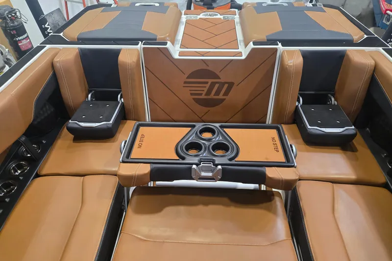 Slide: The Image of Luxurious interior of 2022 Malibu Wakesetter 25 LSV boat with tan leather seating. - 17