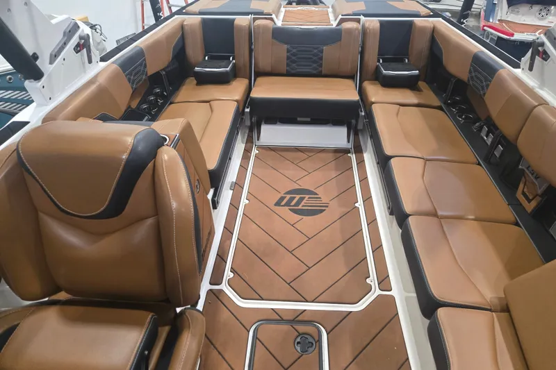 Slide: The Image of 2022 Malibu Wakesetter 25 LSV interior with luxurious brown leather seating. - 20