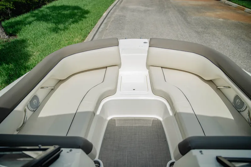 Slide: The Image of 2019 Bayliner 215 Deck Boat interior with spacious seating and modern design. - 16