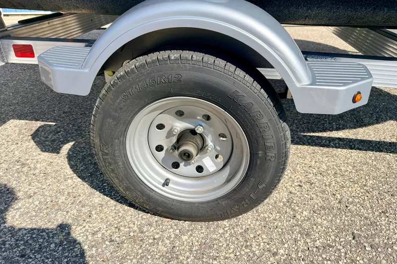 Slide: The Image of Trailer wheel for 2024 Seadoo GTR-X 300 & WAKE 170 on asphalt surface. - 49