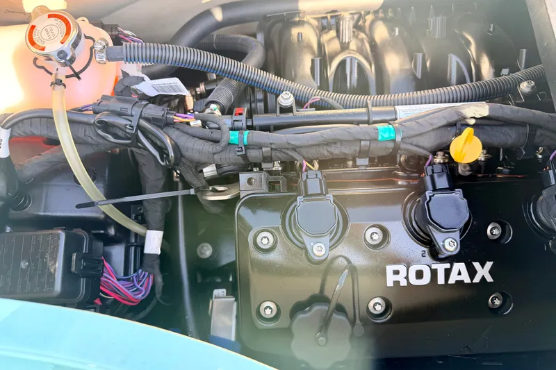 Slide: The Image of 2024 Seadoo GTR-X 300 & WAKE 170 engine with Rotax branding, showcasing intricate components. - 26