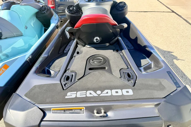 Slide: The Image of 2024 Seadoo GTR-X 300 & WAKE 170 jet skis parked on pavement. - 32