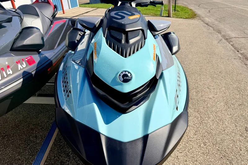 Slide: The Image of 2024 Seadoo GTR-X 300 and WAKE 170 jet skis parked on pavement. - 19