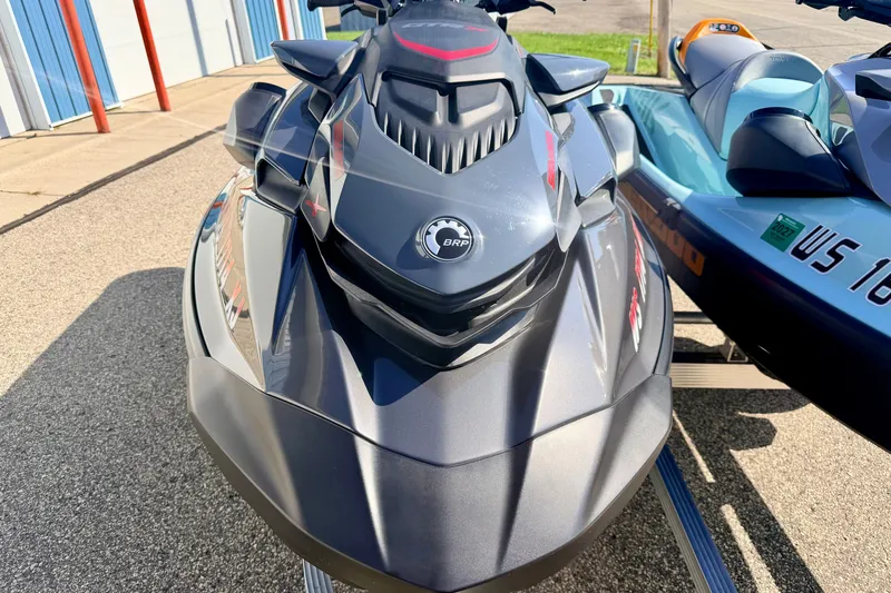 Slide: The Image of 2024 Seadoo GTR-X 300 and WAKE 170 jet skis parked outdoors. - 46