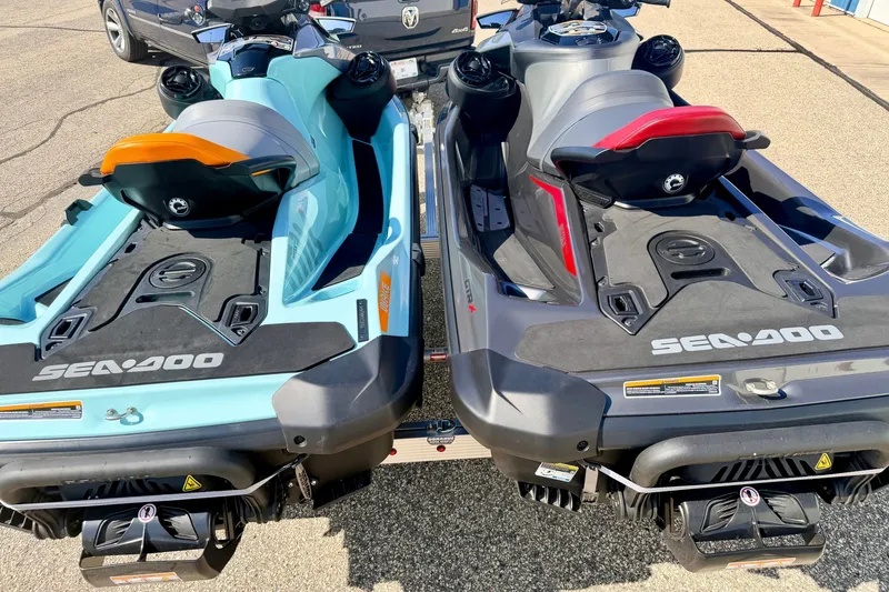 Slide: The Image of 2024 Seadoo GTR-X 300 and WAKE 170 jet skis on trailer, rear view. - 45