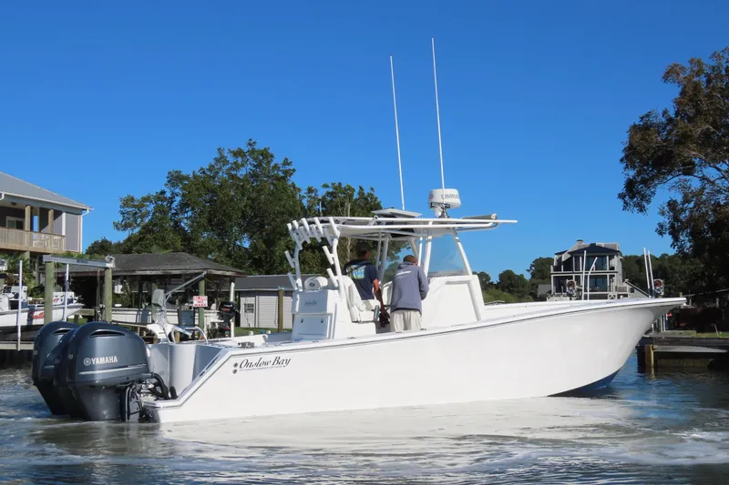 Slide: The Image of 2018 Onslow Bay 33 Tournament Edition boat with Yamaha engines on a sunny day. - 16