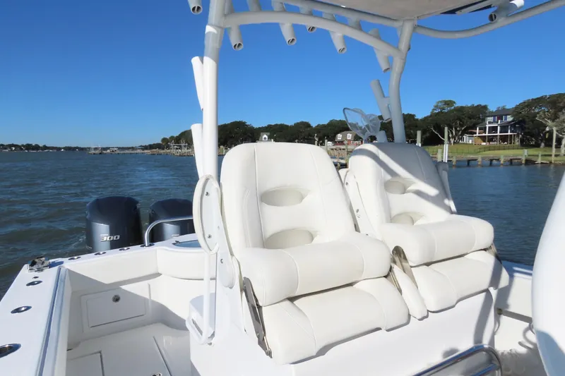 Slide: The Image of 2018 Onslow Bay 33 Tournament Edition boat with dual seats and twin engines on a sunny day. - 20