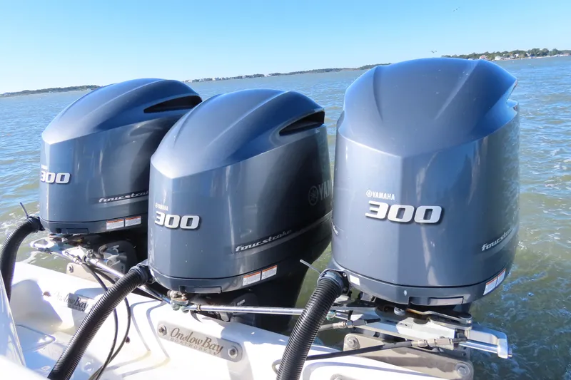 Slide: The Image of Triple Yamaha 300 outboard engines on a 2018 Onslow Bay 33 Tournament Edition boat. - 18