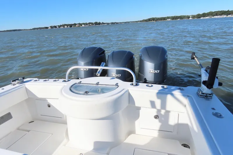 Slide: The Image of 2018 Onslow Bay 33 Tournament Edition boat with triple 300 horsepower engines on open water. - 25