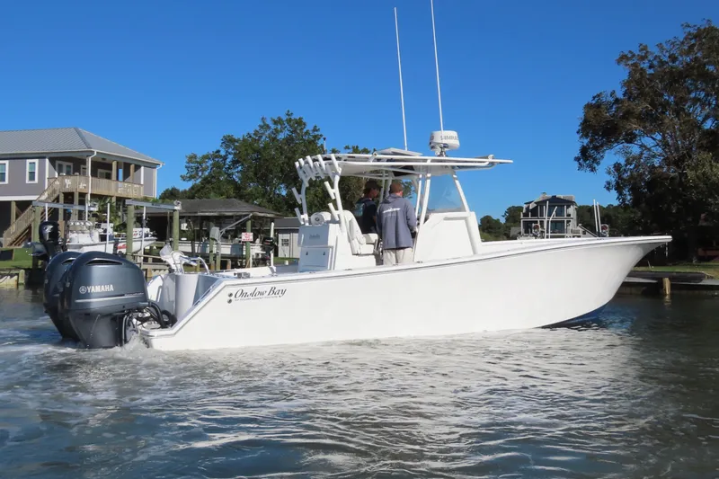 Slide: The Image of 2018 Onslow Bay 33 Tournament Edition boat with Yamaha engines on a sunny day. - 6