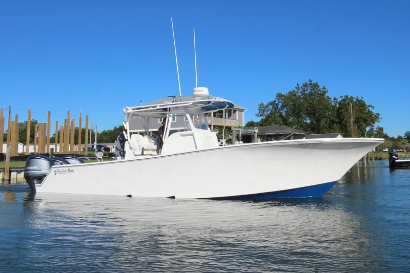 The Image of 2018 Onslow Bay 33 Tournament Edition boat on calm water, clear blue sky. - 0