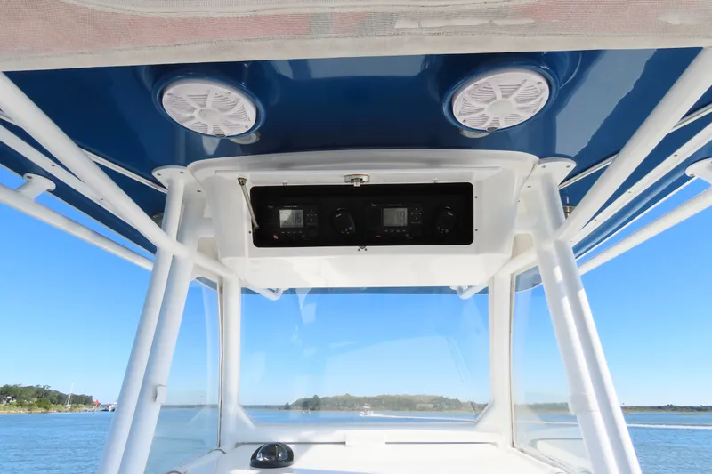 Slide: The Image of 2018 Onslow Bay 33 Tournament Edition boat console with speakers and navigation equipment. - 26