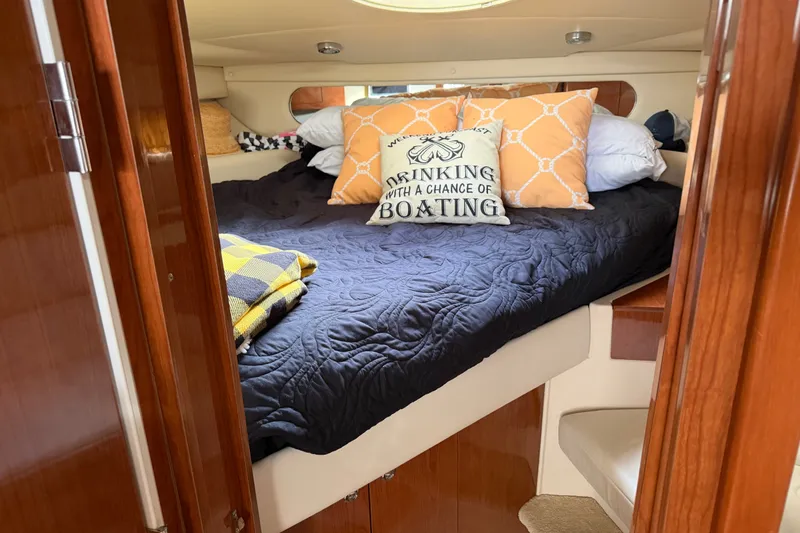 Slide: The Image of Cozy cabin interior of 2005 Regal Commodore 3560 yacht with decorative pillows. - 25