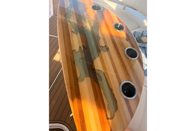 Slide: The Image of Wooden table with cup holders on a 2005 Regal Commodore 3560 boat. - 10