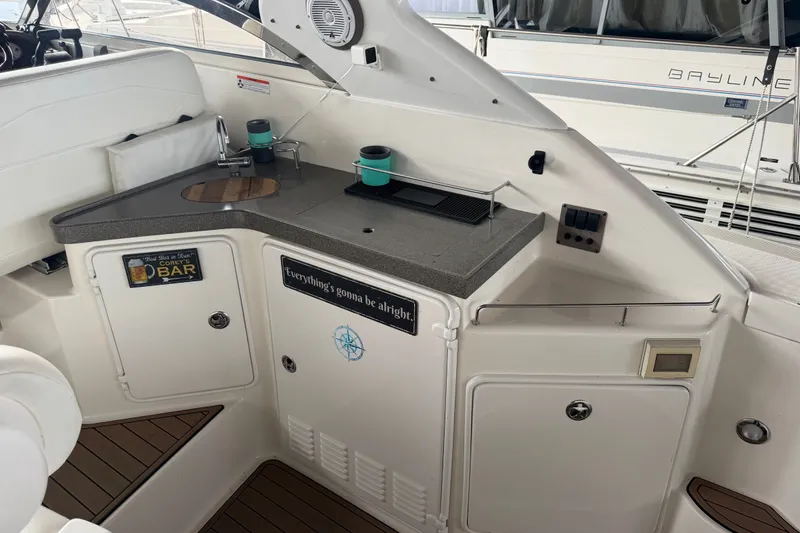 Slide: The Image of 2005 Regal Commodore 3560 yacht interior with kitchenette and bar area. - 12