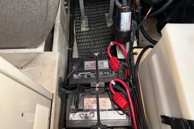Slide: The Image of Battery compartment of a 2005 Regal Commodore 3560 boat with wiring and components. - 44