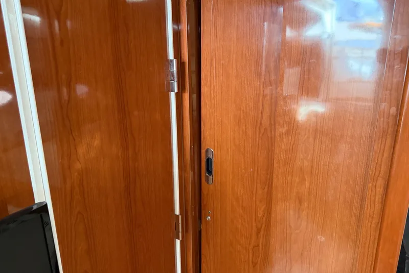 Slide: The Image of Wooden interior door of a 2005 Regal Commodore 3560 yacht. - 24