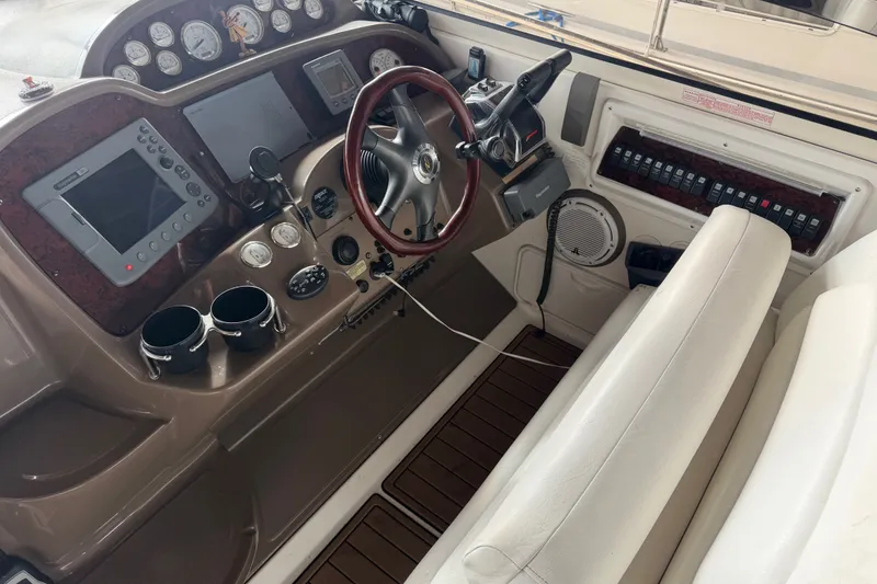 Slide: The Image of Cockpit of 2005 Regal Commodore 3560 with steering wheel and navigation controls. - 5