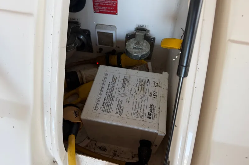 Slide: The Image of Electrical compartment of 2005 Regal Commodore 3560 with cables and power box. - 45
