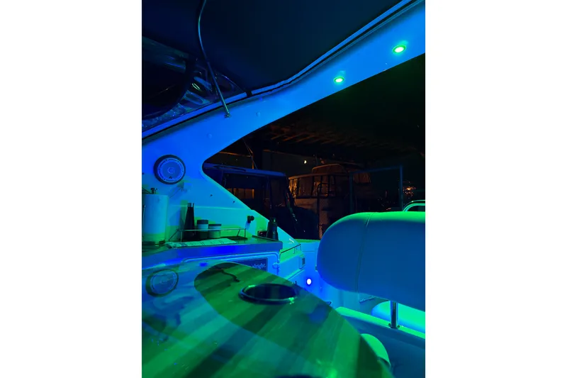 Slide: The Image of Interior of 2005 Regal Commodore 3560 yacht with ambient blue lighting. - 46