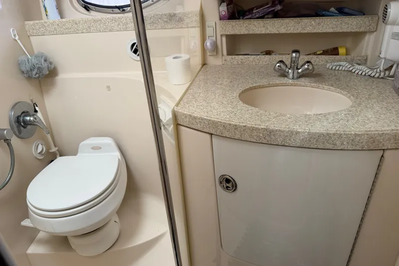 Slide: The Image of Bathroom interior of 2005 Regal Commodore 3560 yacht with toilet and sink. - 30