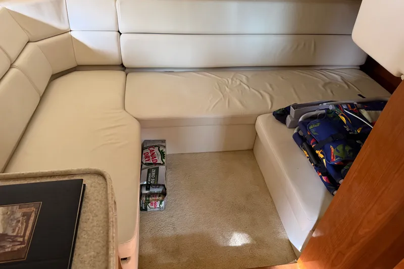 Slide: The Image of Luxurious interior of 2005 Regal Commodore 3560 yacht with white seating and carpet. - 35
