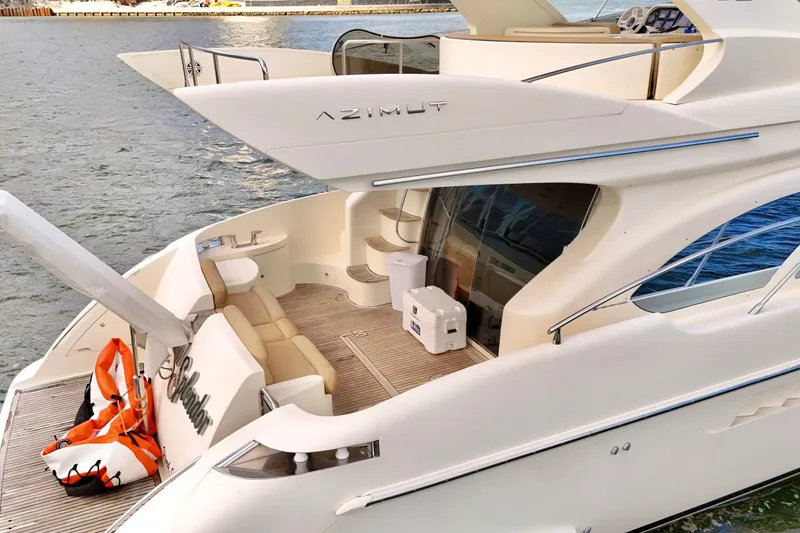 Slide: The Image of 2007 Azimut 55E yacht with spacious deck and elegant design on the water. - 15