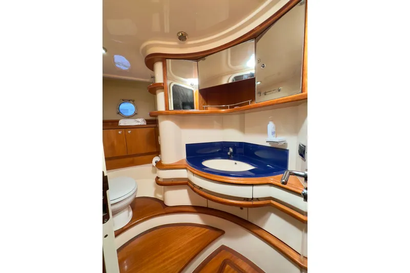 Slide: The Image of Luxurious 2007 Azimut 55E yacht bathroom with elegant wood accents and modern fixtures. - 45