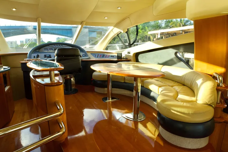 Slide: The Image of Luxurious interior of a 2007 Azimut 55E yacht with plush seating and elegant wood finishes. - 37