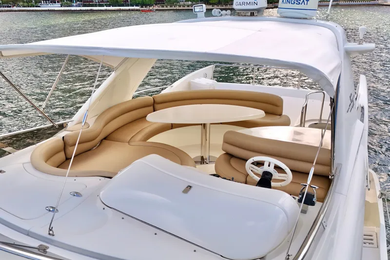 Slide: The Image of Luxurious 2007 Azimut 55E yacht with elegant seating and navigation equipment on deck. - 20