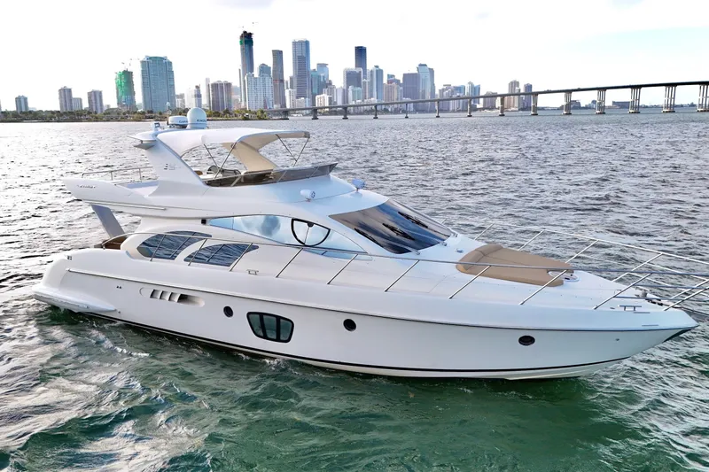 Slide: The Image of Luxury 2007 Azimut 55E yacht cruising near city skyline and bridge. - 2