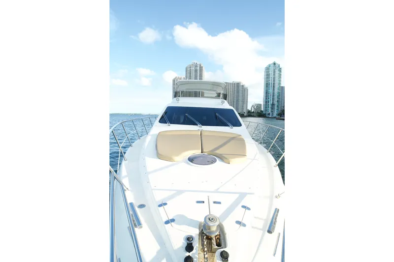 Slide: The Image of 2007 Azimut 55E yacht on water with city skyline in background. - 24