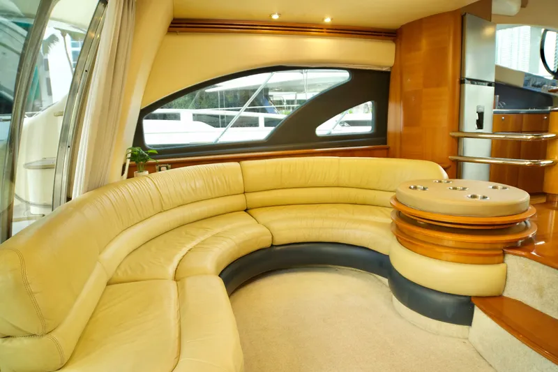 Slide: The Image of Luxurious interior of a 2007 Azimut 55E yacht with curved leather seating. - 29