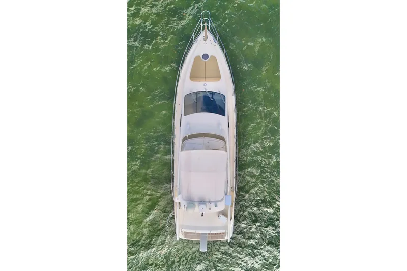 Slide: The Image of Aerial view of 2007 Azimut 55E yacht on green water. - 12