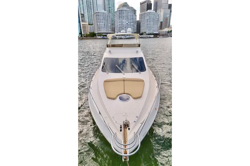 Slide: The Image of 2007 Azimut 55E yacht on water with city skyline background. - 13