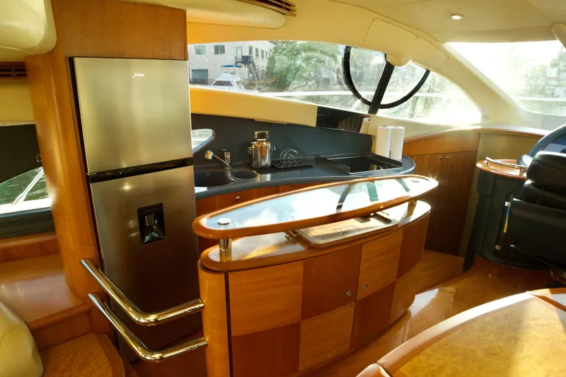Slide: The Image of Luxurious 2007 Azimut 55E yacht interior with modern kitchen and sleek design. - 38