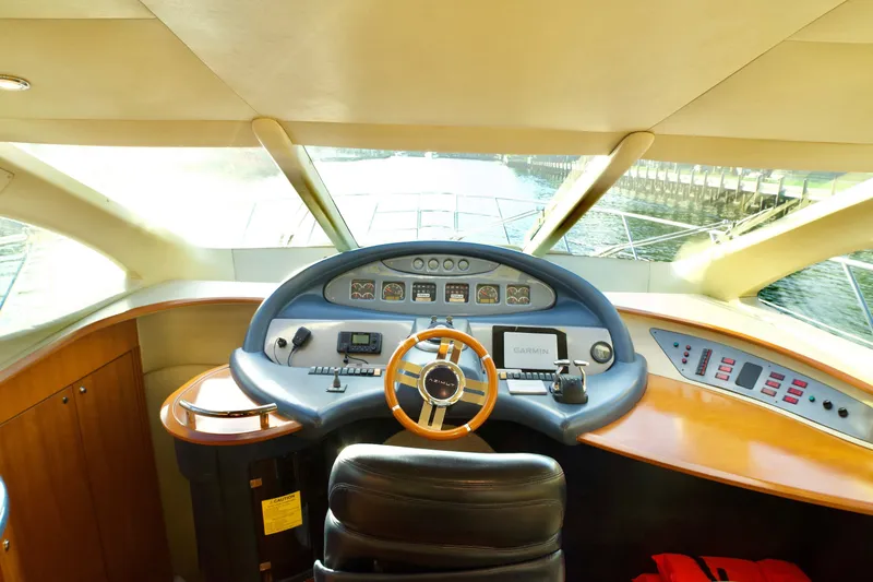 Slide: The Image of Cockpit of 2007 Azimut 55E yacht with steering wheel and navigation controls. - 40