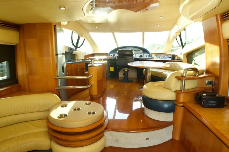 Slide: The Image of Luxurious interior of a 2007 Azimut 55E yacht with elegant wood and leather furnishings. - 34