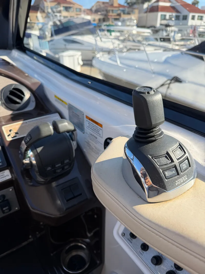 Slide: The Image of The image shows the helm of a 2013 Regal 35 Sport Coupe with joystick controls. - 20