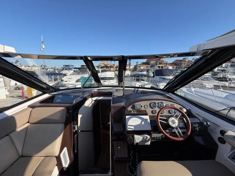 Slide: The Image of The cockpit of a 2013 Regal 35 Sport Coupe with a modern dashboard and comfortable seating. - 19