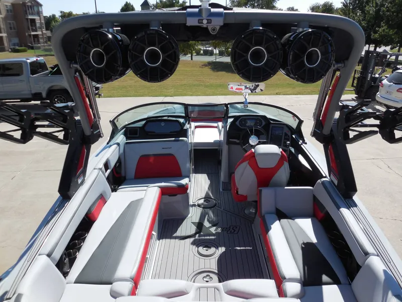 Slide: The Image of The image shows the interior of a 2023 MasterCraft XStar S boat with modern seating and speakers. - 15