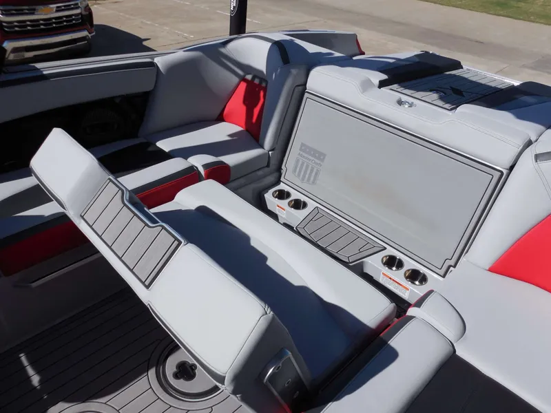 Slide: The Image of The image shows the interior of a 2023 MasterCraft XStar S with gray and red seating. - 25