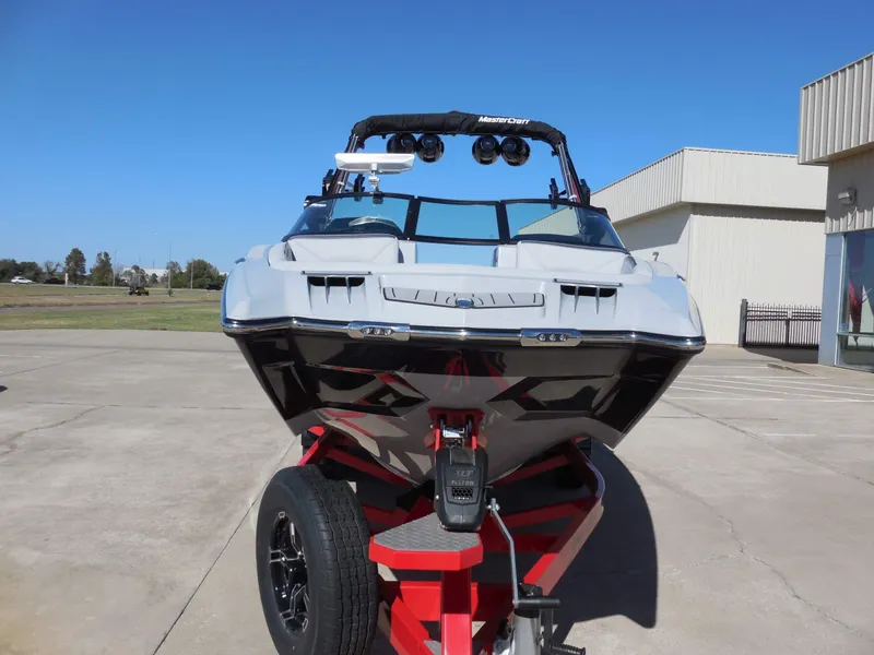 Slide: The Image of A 2023 MasterCraft XStar S on a red trailer, ready for watersport adventures. - 8