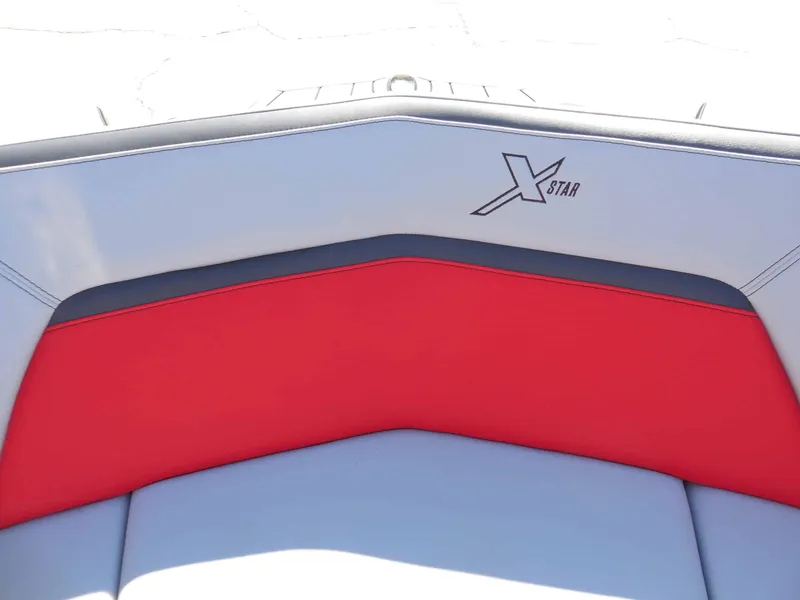 Slide: The Image of The image shows the rear seat of a 2023 MasterCraft XStar S with gray and red upholstery. - 22