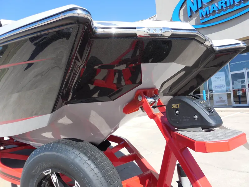 Slide: The Image of The image shows the stern of a MasterCraft XStar S boat on a trailer. - 9