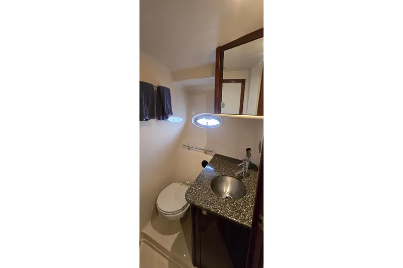 Slide: The Image of Bathroom interior of 2008 Sea Ray 38 Sundancer yacht with sink and toilet. - 34