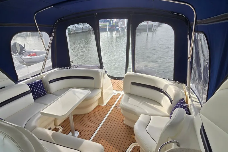 Slide: The Image of Interior of 2008 Sea Ray 38 Sundancer yacht with elegant seating and waterfront view. - 5