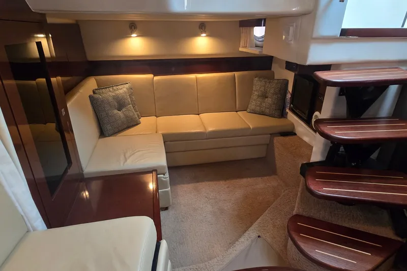 Slide: The Image of Luxurious interior of 2008 Sea Ray 38 Sundancer yacht with plush seating and elegant lighting. - 25